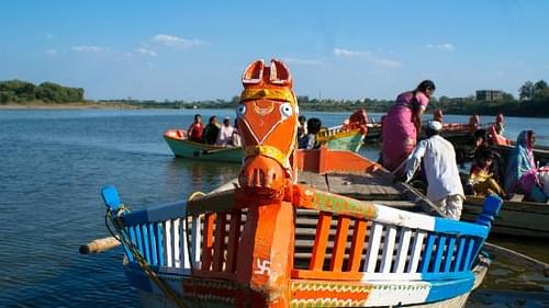 Enjoy a boat ride on the Chandrabhaga River